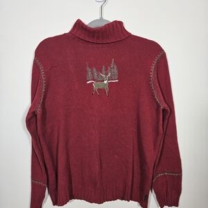 Woolrich Cranberry Turtleneck With Buck Design And Blanket Stitching.